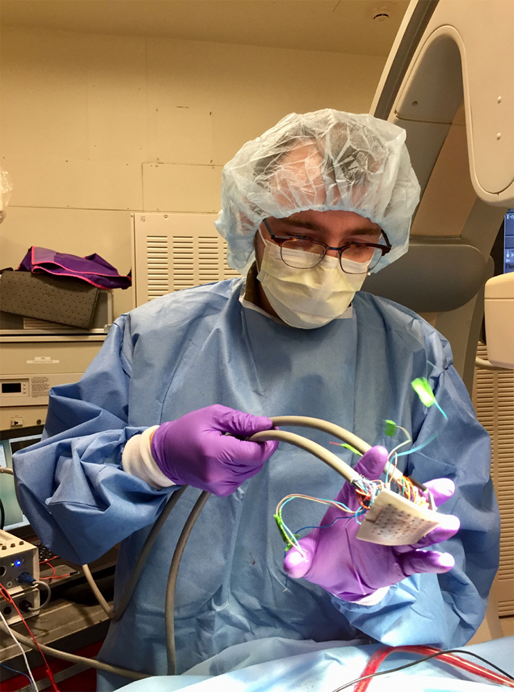 Cyr demonstrates how a surgeon uses the customized cardiac-mapping device in the operating room. Photo via Kevin Cyr.