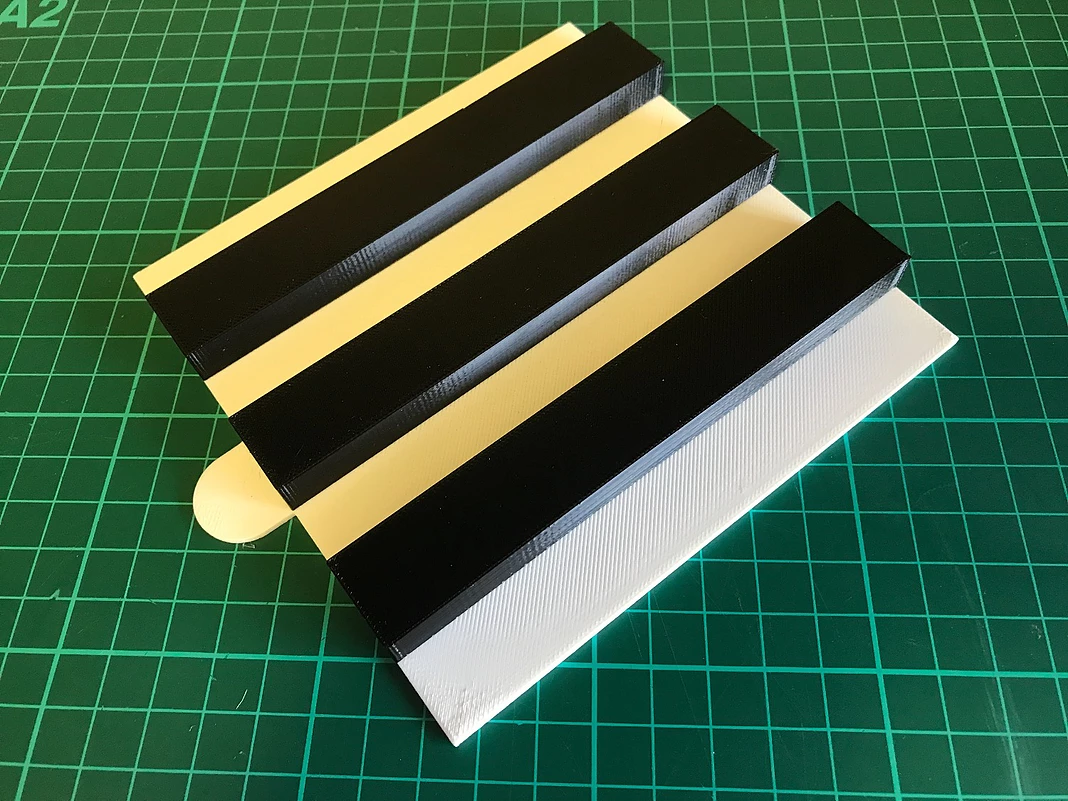 3D printed black and white slices which are used to assembled the visual aid shapes. Photo via Print My Part.